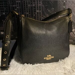 The COACH Ellie File Bag Bag from Black Pebbled Leather with Gold Hardware